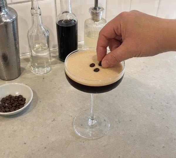 Step 6: Place 3 coffee beans