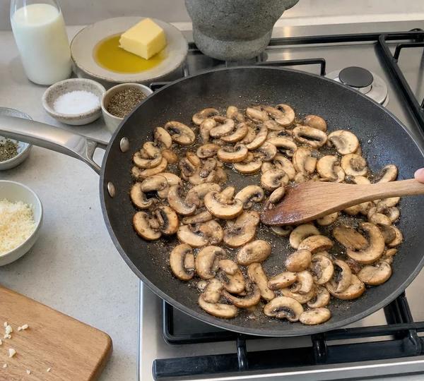 Step 3: Add sliced mushrooms and cook