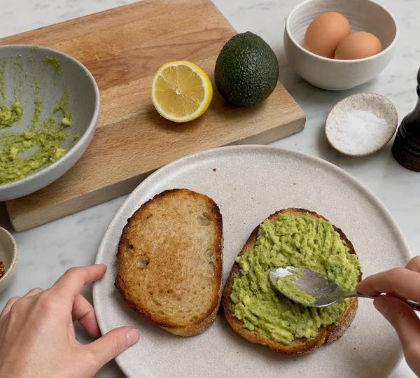 Step 6: Spread the smashed avocado thickly