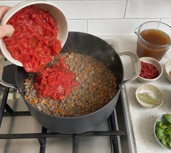 Step 6: Add chopped tomatoes