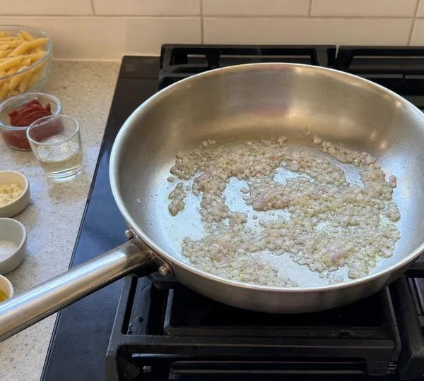 Step 3: Add the shallot and sweat