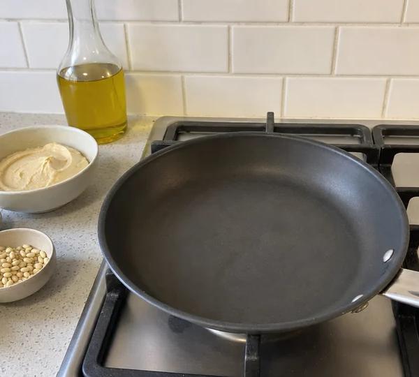 Step 1: Heat a small dry pan