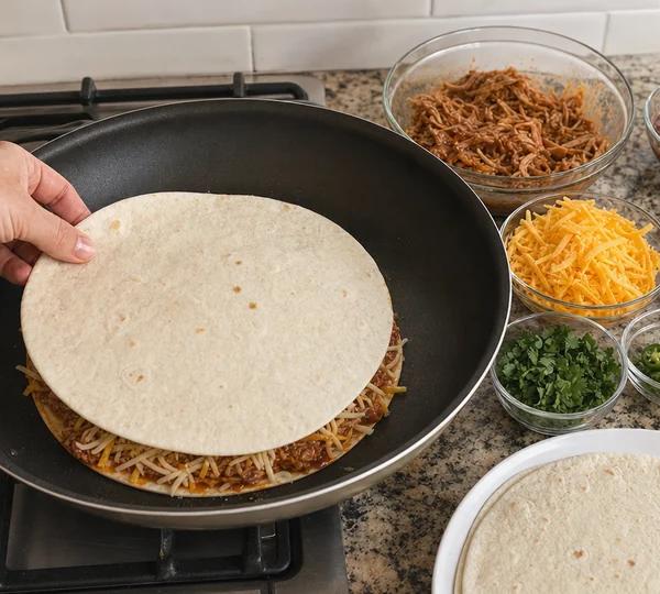 Step 4: Place another tortilla on top