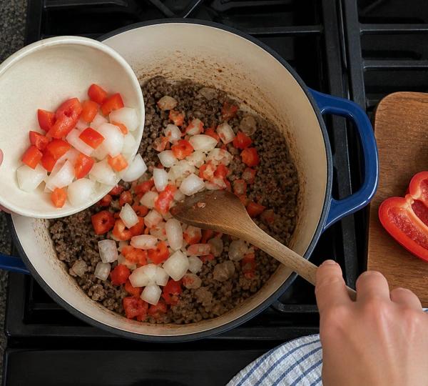 Step 6: Add diced onion and bell