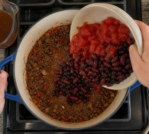 Step 9: Pour in chopped tomatoes