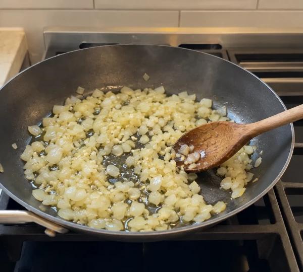 Step 2: Sauté onion and garlic