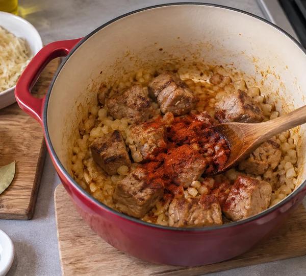 Step 3: Bloom the paprika off the heat