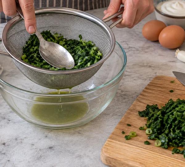 Step 3: Squeeze the spinach dry