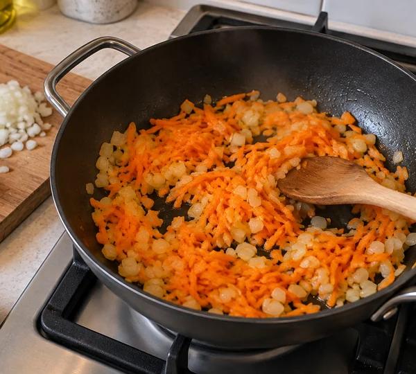 Step 1: Soften the onion and carrot