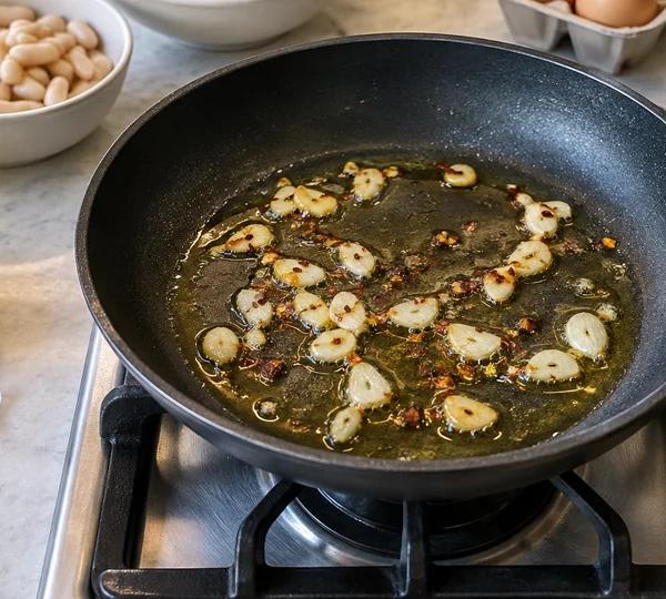 Step 1: Warm the garlic