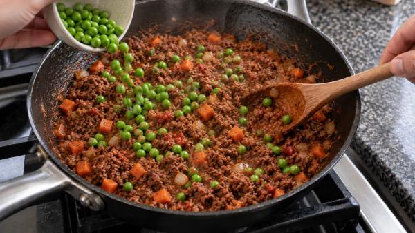 Step 9: Stir in the peas