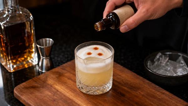 Step 4: Drop 3 dashes of Angostura