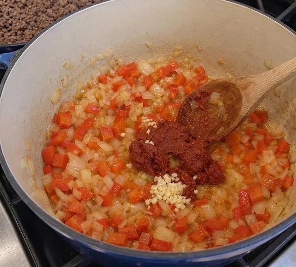 Step 7: Stir in minced garlic