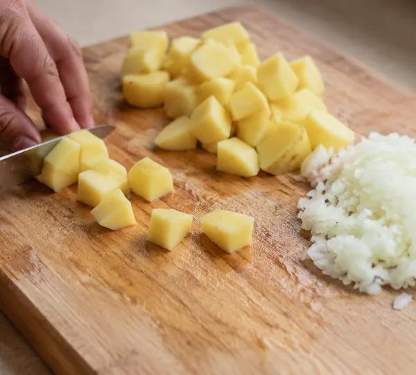 Step 2: Peel the potatoes and cut