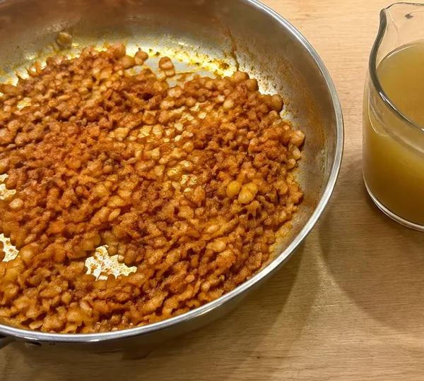 Step 8: Pour in the stock