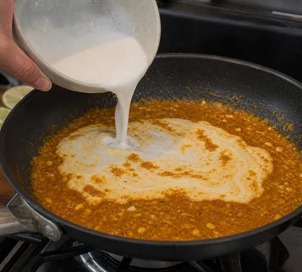 Step 3: Pour in the coconut milk