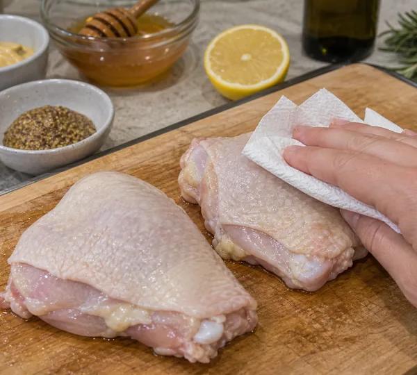 Step 2: Pat chicken thighs extremely dry