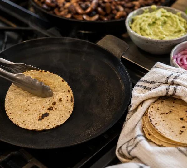 Step 17: Warm each corn tortilla