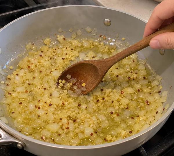 Step 4: Add the garlic and red