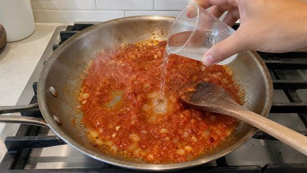 Step 5: Add tomato + vodka