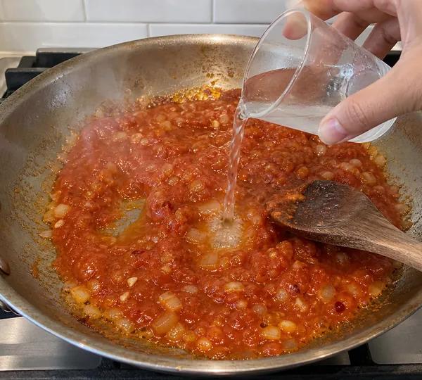 Step 5: Add tomato + vodka