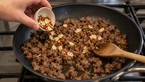 Step 3: Add garlic and chili
