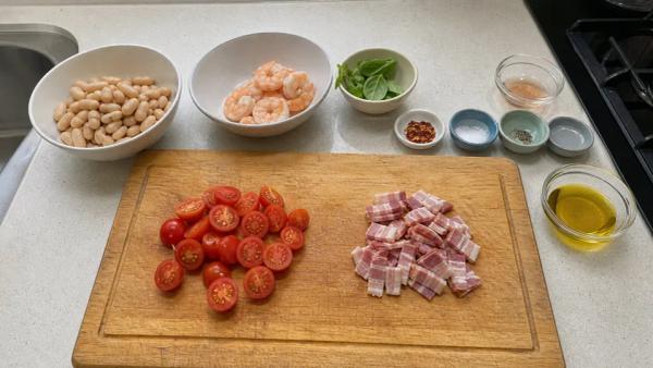 Step 2: Wash and halve the tomatoes