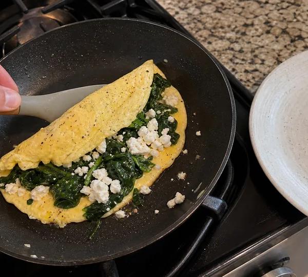 Step 8: Scatter the wilted spinach across